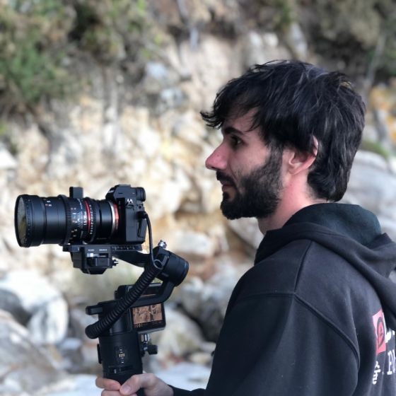 Josh, filmmaker, holding a camera